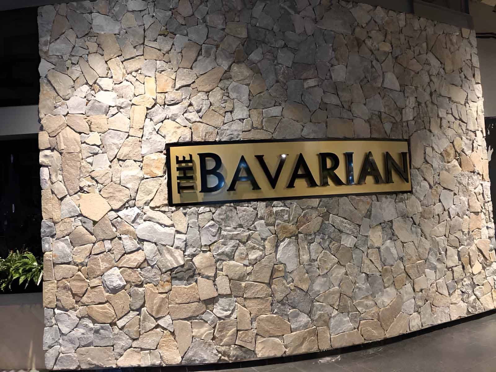 Natural stone feature wall with a The Bavarian sign